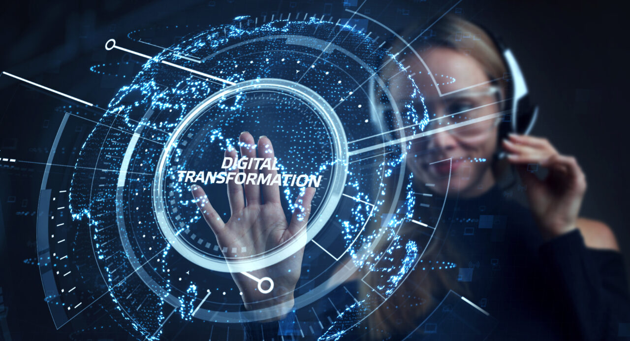 A human agent touching the virtual representation of digital transformation