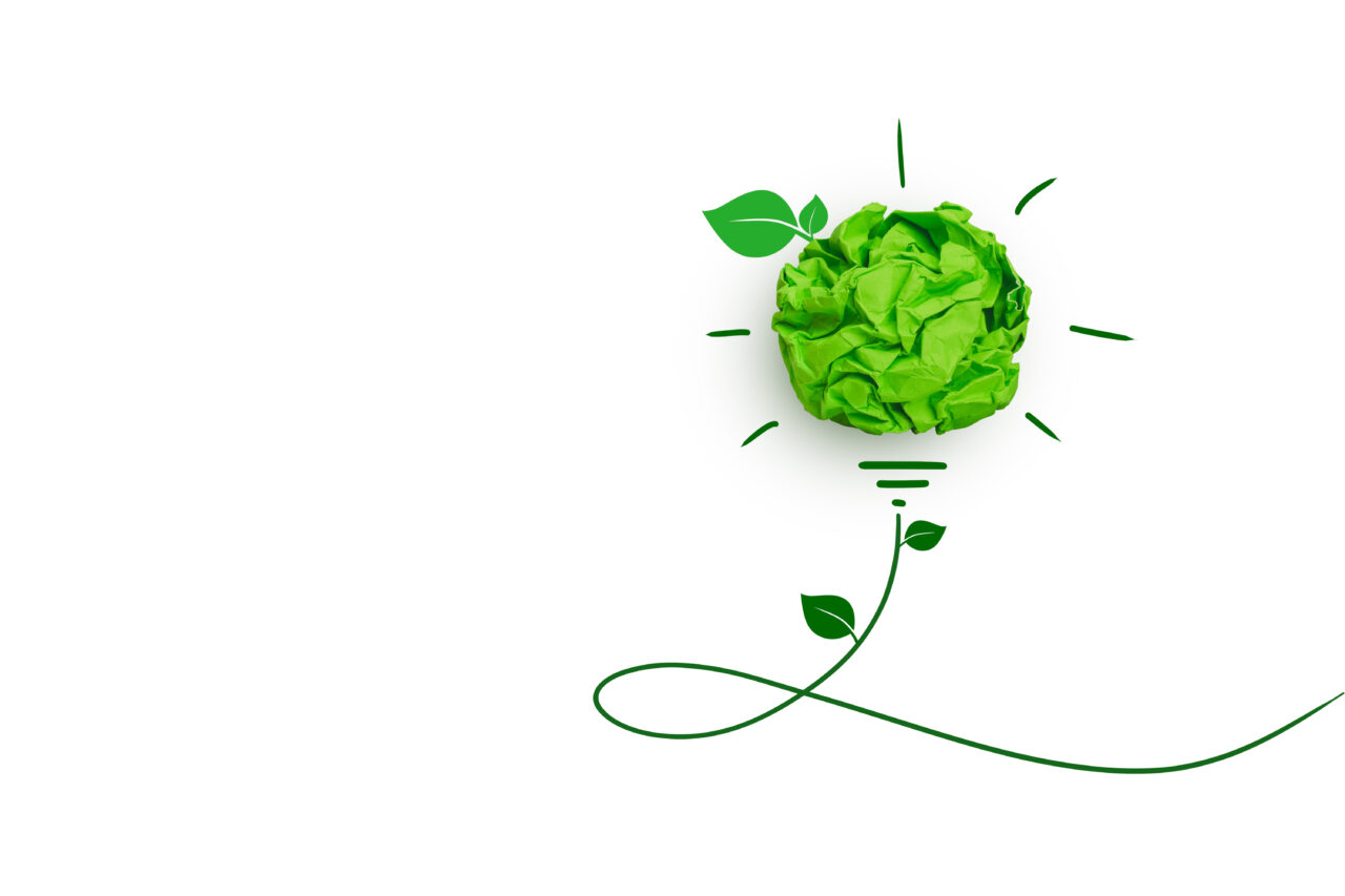 Green papers form a bulb, therefore, representing an idea about sustainability.