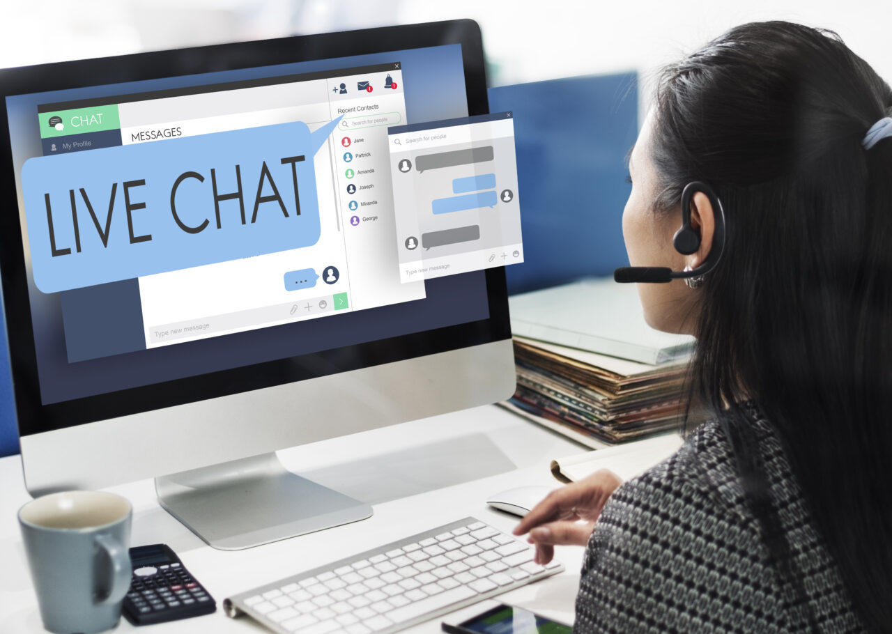 an image showing a woman using the live chat as a future of customer service. 