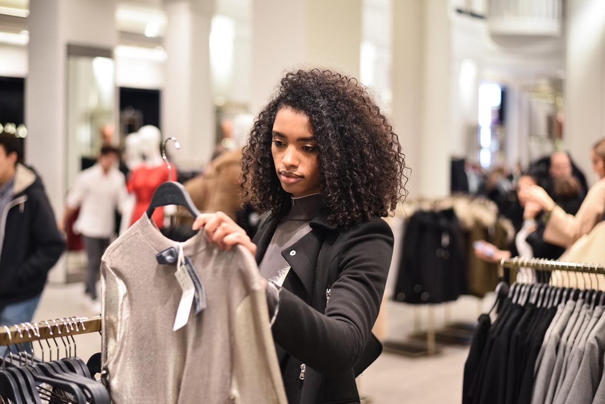 Black young woman doing shopping in a store