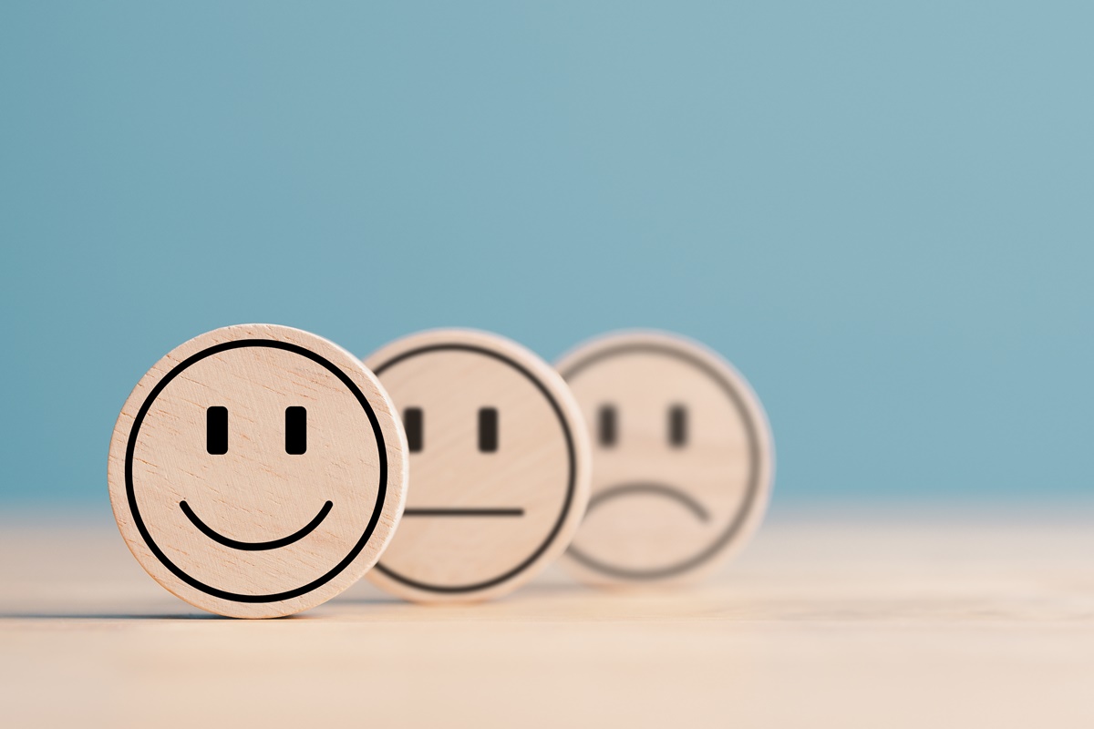 Wooden label with happy normal and sad face icons for experience survey services and products review concept. Customer or Client show Good Neutral or Negative feedback and satisfaction rating.