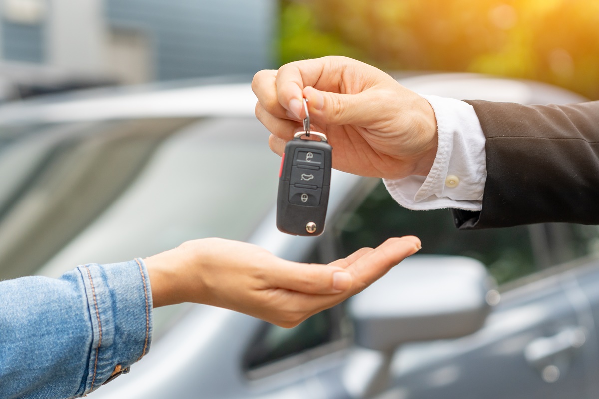 lease, rental car, sell, buy. Dealership manager send car keys to the new owner. Sales, loan credit financial, rent vehicle, insurance, renting, Seller, dealer, installment, car care business