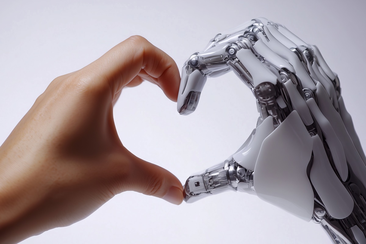 Human and robotic hands joining together to create a heart shape, symbolizing the potential for love, connection, and collaboration between humans and artificial intelligence