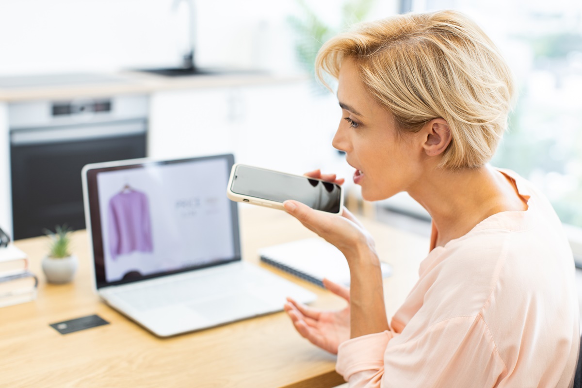 Caucasian woman frustrated over online shopping delivery issue calls customer service for assistance. Concept of online shopping issues, customer dissatisfaction, retail complications.